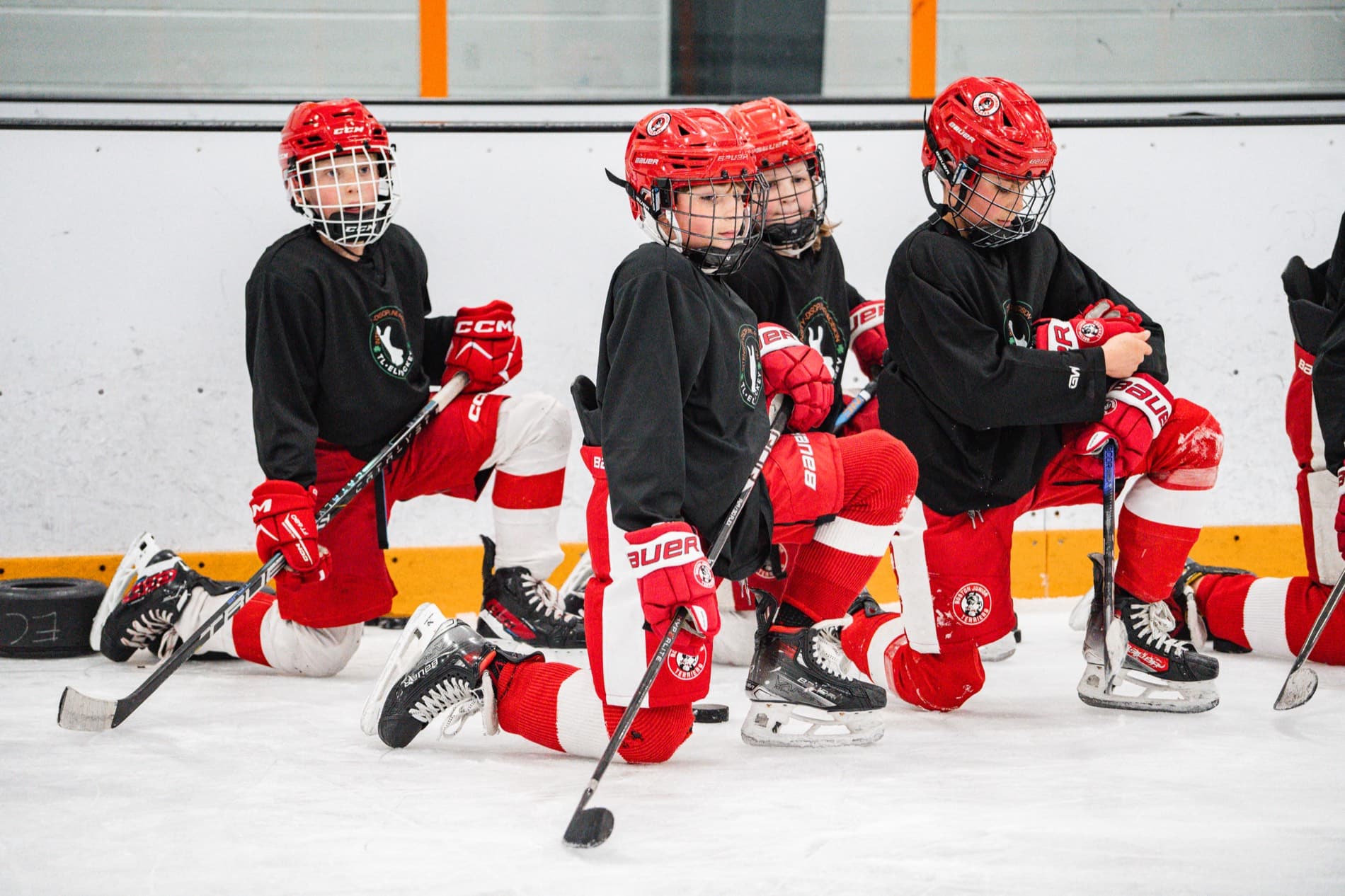 TL Elite players battling for the puck during a small-group session